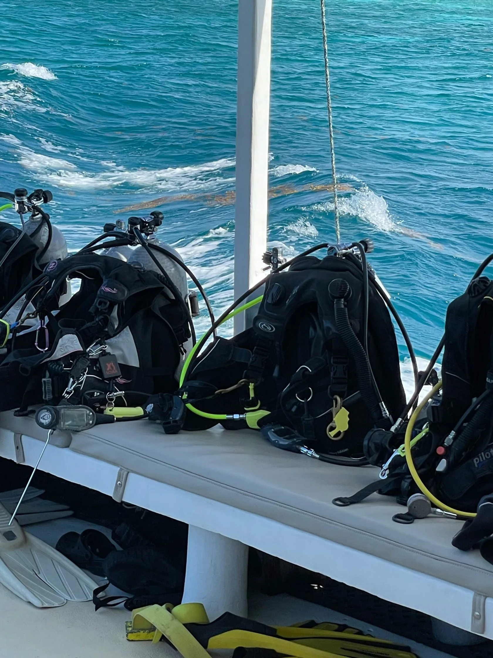 Diver descending into deep blue water