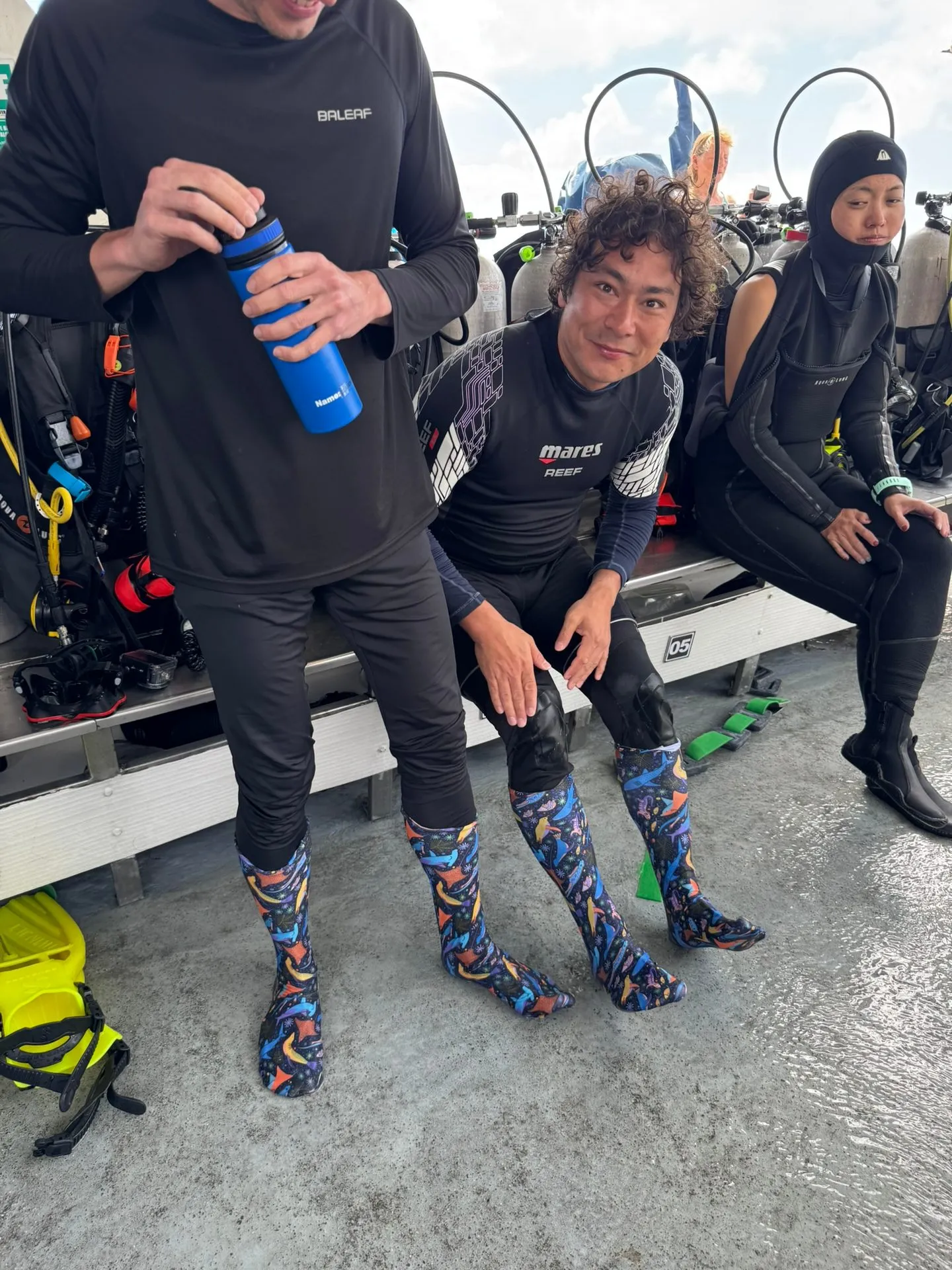 Friends on the dive boat wearing the prototype socks