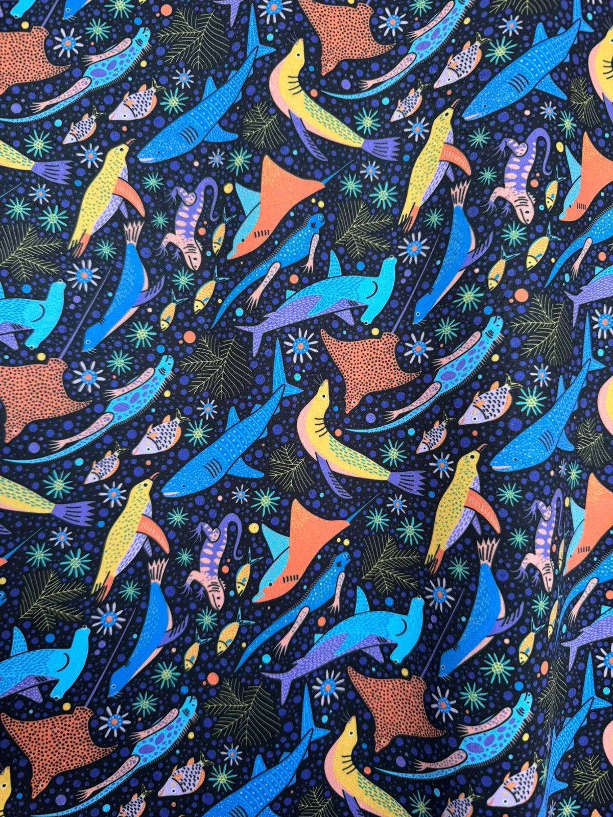 Yuliia's finished Galápagos marine pattern: hammerheads, rays and marine iguanas on deep blue
