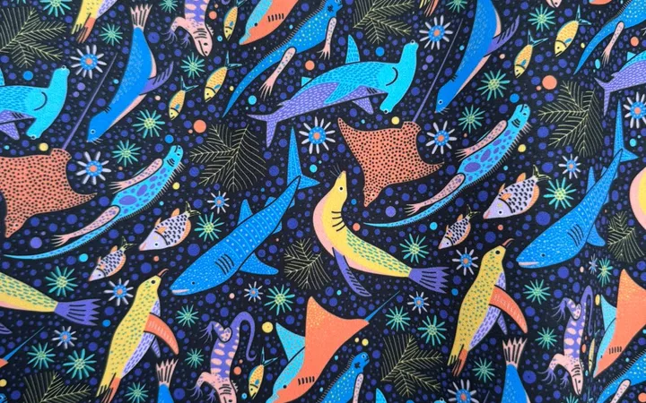 Yuliia's finished Galápagos marine pattern: hammerheads, rays and marine iguanas on deep blue